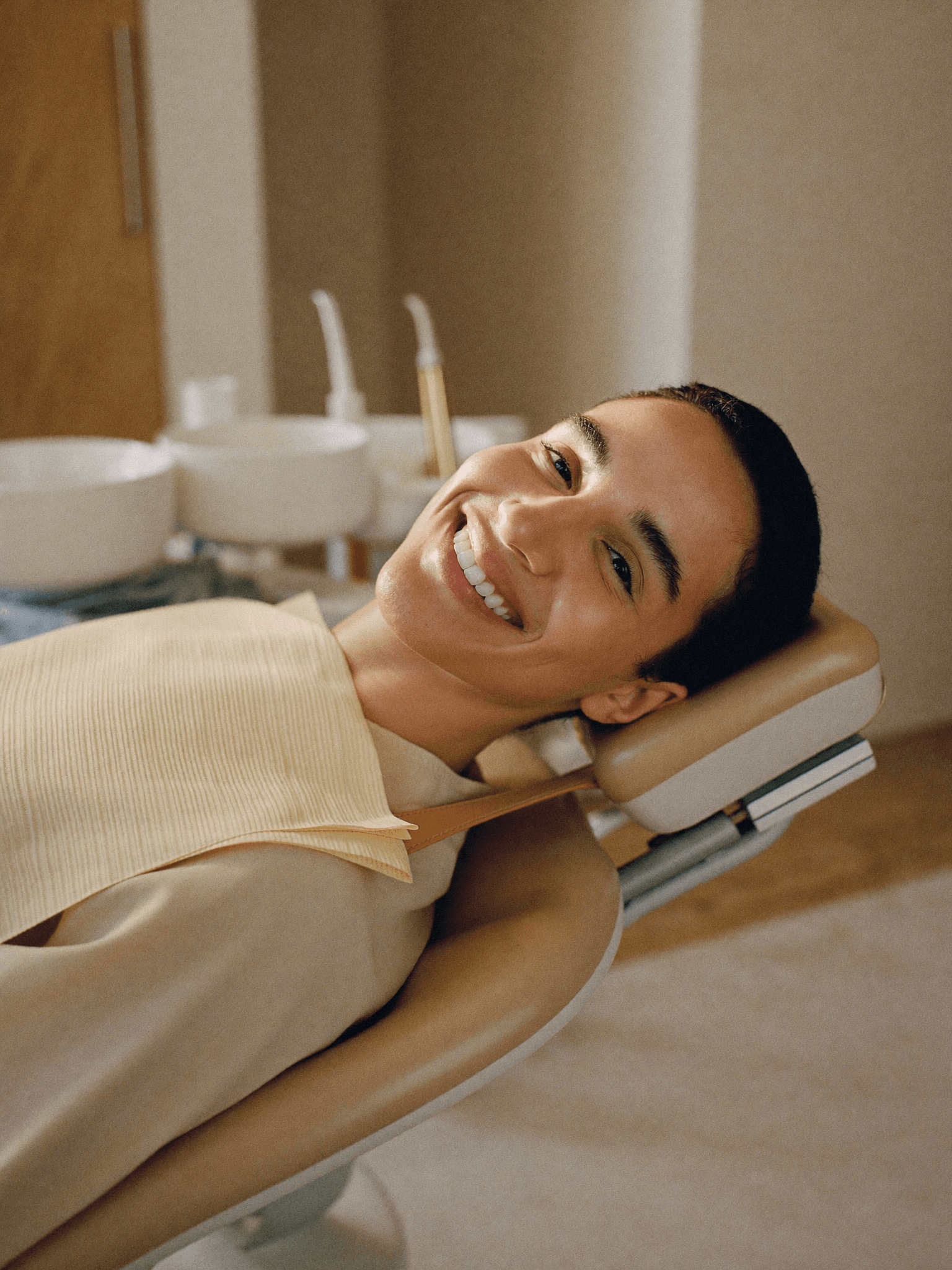 A calm, comfortable patient in a modern dental chair