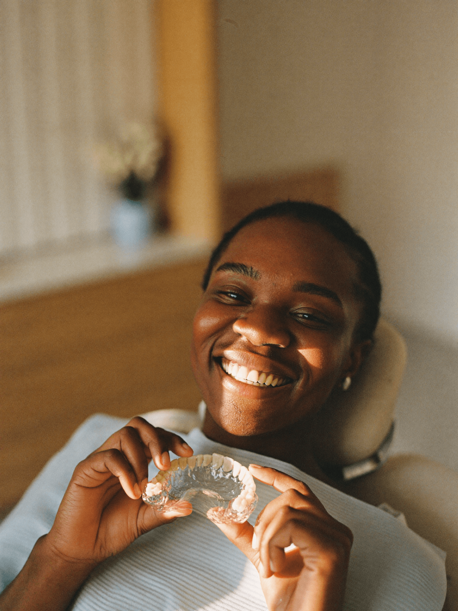 A patient with a straight, confident smile