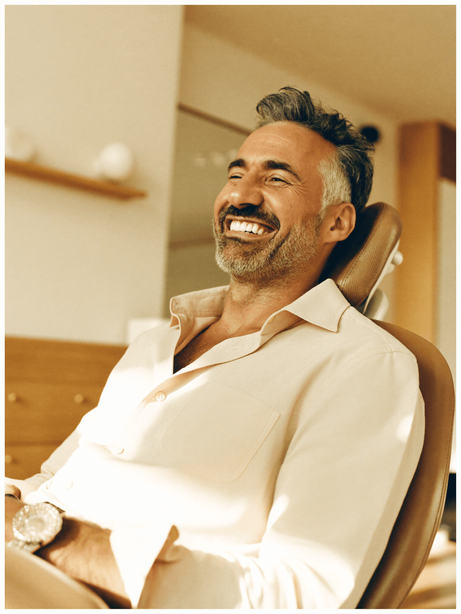 A patient with a fully restored, healthy, natural smile